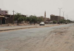 A vehicle crosses an empty street in Khartoum, Sudan, Saturday, April 29, 2023, as gunfire and heavy artillery fire continued despite the extension of a ceasefire between the country's two top generals. (AP)