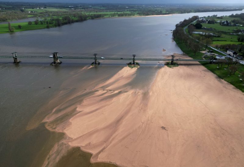 A view shows a bridge with sandbanks of the Loire River in Ingrandes-le-Fresne-sur-Loire, France, March 30, 2023. REUTERS/Stephane Mahe
