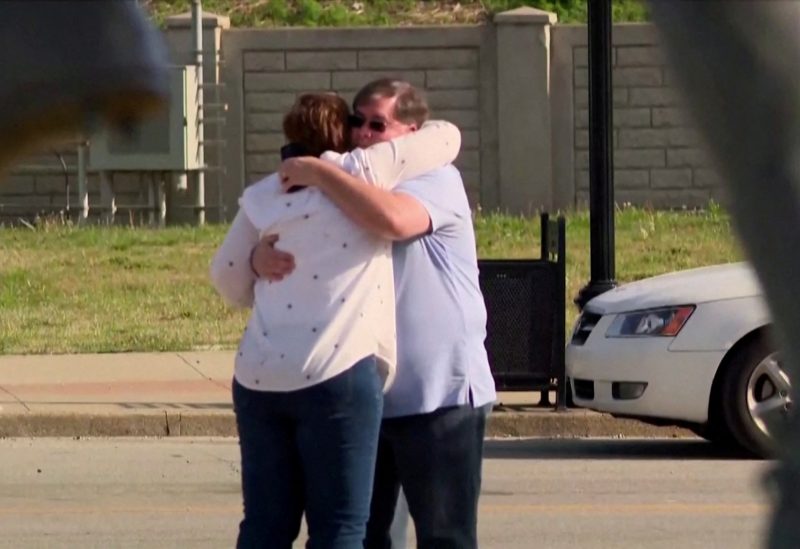 People embrace after an "active police situation" that included mass casualties at Old National Bank in Louisville, Kentucky, U.S. April 10, 2023 in a still image from video. ABC affiliate WHAS via REUTERS