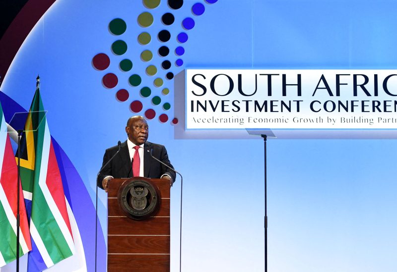 South Africa's President Cyril Ramaphosa looks on as he delivers the opening address at the 5th Investment Conference to showcase opportunities available in the country to local and international companies, in Sandton, South Africa, April 13, 2023. Jairus Mmutle/Government Communication Information System (GCIS)/Handout via REUTERS