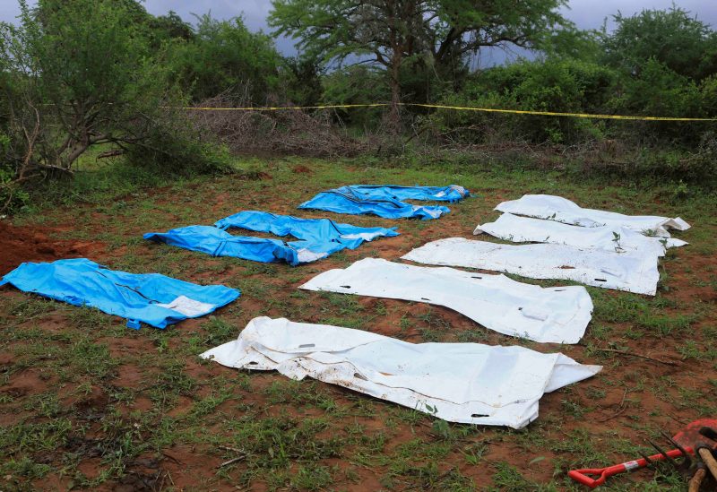 Body bags are seen arranged as forensic experts and homicide detectives exhume bodies of suspected members of a Christian cult named as Good News International Church, who believed they would go to heaven if they starved themselves to death, in Shakahola forest of Kilifi county, Kenya April 22, 2023. REUTERS/Stringer