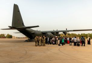 British nationals board an RAF aircraft, after being evacuated in Khartoum, Sudan April 25, 2023. LPhot Mark Johnson/UK MOD/Pool via REUTERS