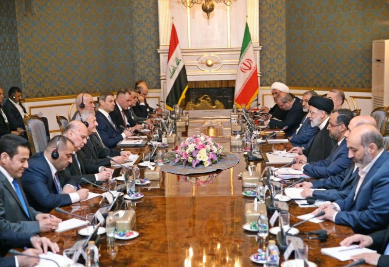 Iraqi President Abdul Latif Rashid and Iranian President Ebrahim Raisi attend a meeting, in Tehran, Iran April 29, 2023. The Presidency of the Republic of Iraq Office/Handout via REUTERS