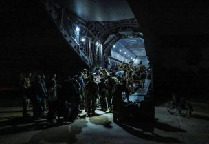 British nationals board an RAF plane during the evacuation from Wadi Seidna Air Base, Sudan April 28, 2023 in this handout image. Arron Hoare/UK Ministry of Defence/Handout via REUTERS
