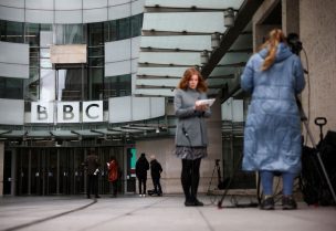 Members of the media work outside the BBC headquarters, in London, Britain April 28, 2023. REUTERS
