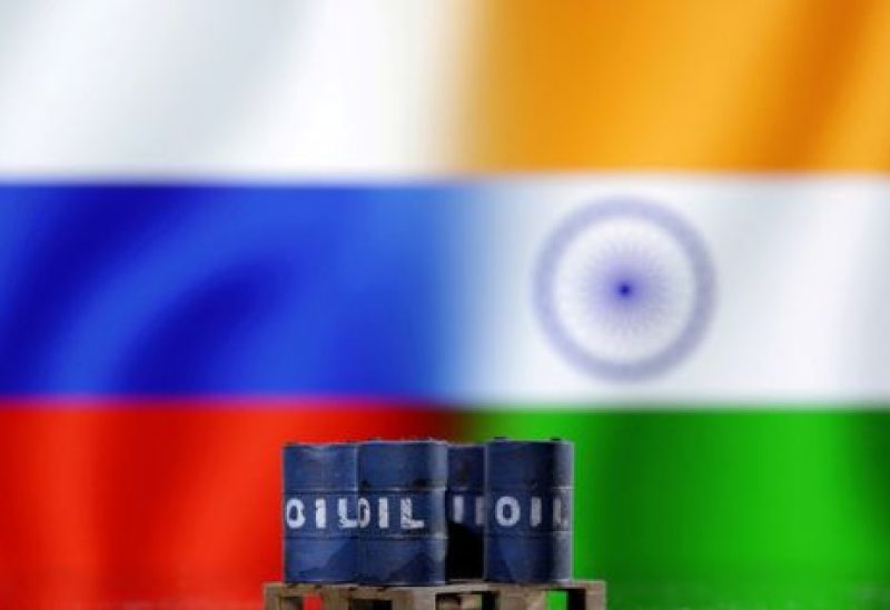 A model of oil barrels is seen in front of Russian and Indian flags in this illustration taken, December 9, 2022. REUTERS/Dado Ruvic/Illustration