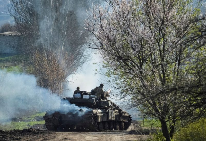 Ukrainian service members ride a tank, as Russia's attack on Ukraine continues, near the front line city of Bakhmut, Ukraine April 10, 2023. REUTERS