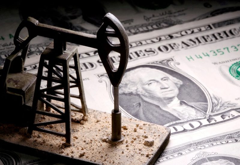 FILE PHOTO: A 3D printed oil pump jack is placed on dollar banknotes in this illustration picture, April 14, 2020. REUTERS/Dado Ruvic/Illustration/File Photo