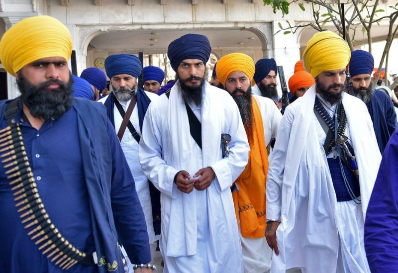 Amritpal Singh, a radical Sikh leader, leaves the holy Sikh shrine of the Golden Temple along with his supporters, in Amritsar, India, March 3, 2023. REUTERS