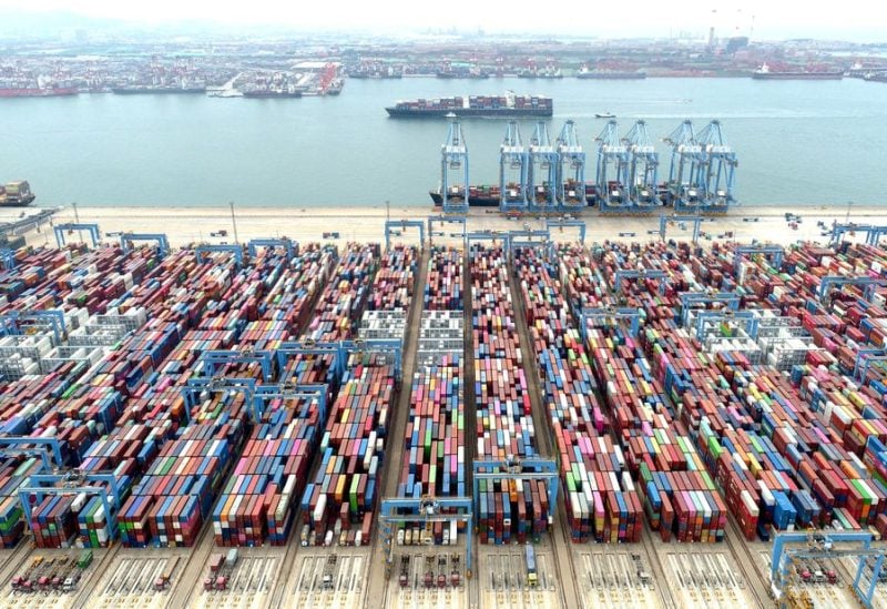 An aerial view shows containers and cargo vessels at the Qingdao port in Shandong province, China May 9, 2022. Picture taken with a drone. China Daily via REUTERS