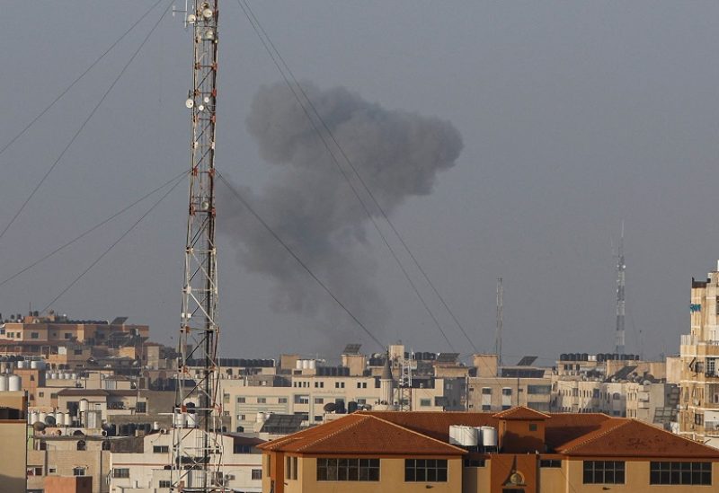 Smoke rises amid buildings during Israeli airstrikes in Gaza April 5, 2023. REUTERS/Mohammed Salem