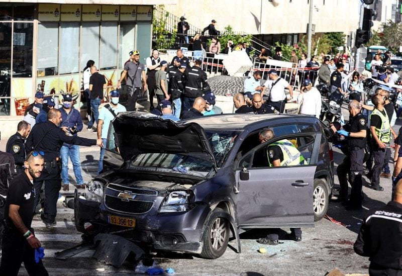 Israeli security forces and rescue workers work at the scene following an incident by Jerusalem's main market, April 24, 2023. REUTERS/Ronen Zvulun