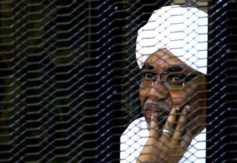 Sudan's former president Omar Hassan al-Bashir sits inside a cage at the courthouse where he is facing corruption charges, in Khartoum, Sudan September 28, 2019. REUTERS