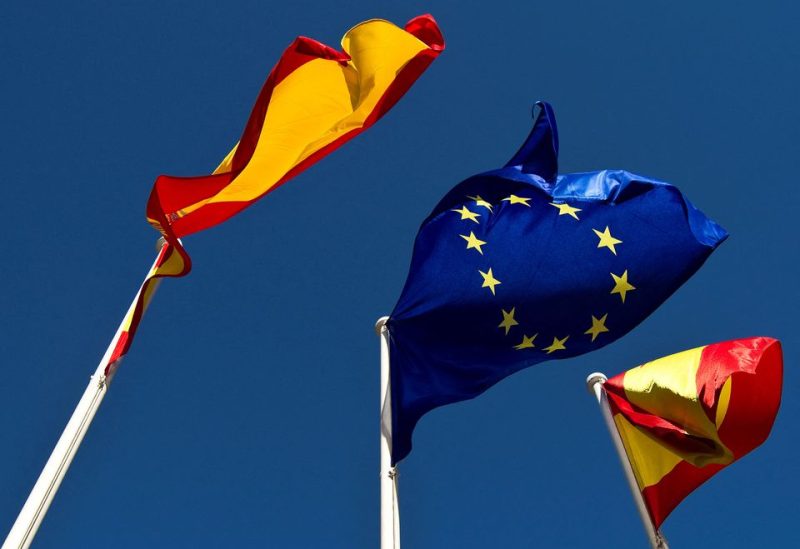 A European Union flag flies between two Spanish flags in central Madrid January 26, 2010. REUTERS