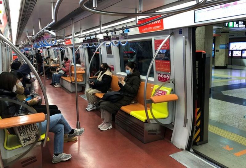 People ride on a subway during evening rush hour, after the government loosened coronavirus disease (COVID-19) restrictions, in Beijing, China December 9, 2022. REUTERS