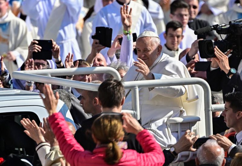 Pope Francis greets the crowd ahead of a holy mass at the Kossuth Lajos Square during his apostolic journey in Budapest, Hungary, April 30, 2023. REUTERS