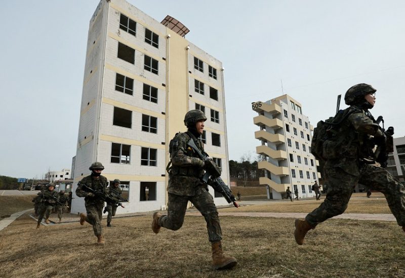 FILE PHOTO: South Korean soldiers take part in a joint military drill which is a part of the Freedom Shield joint military exercise between South Korea and U.S., at a military training field near the demilitarized zone separating the two Koreas in Paju, South Korea, March 16, 2023. Yonhap via REUTERS ATTENTION EDITORS - THIS IMAGE HAS BEEN SUPPLIED BY A THIRD PARTY. SOUTH KOREA OUT. NO RESALES. NO ARCHIVE./File Photo/File Photo