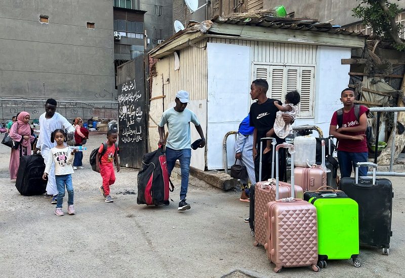 Sudanese and people from other nationalities, evacuated from the last crisis in Khartoum, wait after their arrival by bus in the Egyptian capital of Cairo, through the Argeen's southern border of Egypt-Sudan, in Cairo, Egypt, April 27, 2023. REUTERS/Amr Abdallah Dalsh