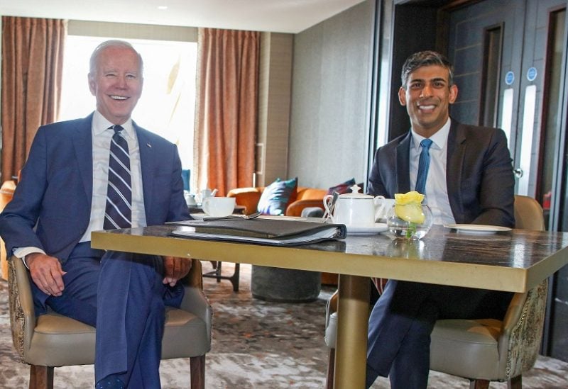 US President Joe Biden (L) reacts as he meets with Britain's Prime Minister Rishi Sunak in Belfast on April 12, 2023, as part of a four day trip to Northern Ireland and Ireland for the 25th anniversary commemorations of the "Good Friday Agreement". Paul Faith/Pool via REUTERS