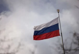 The national flag of Russia flies atop the Russian embassy, as Russia's invasion of Ukraine continues, in Berlin, Germany, April 5, 2022. REUTERS