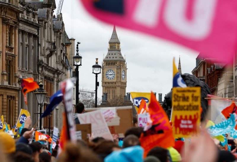 The Elizabeth Tower, more commonly known as Big Ben, is seen as teachers attend a march during strike action in a dispute over pay, in London, Britain March 15, 2023. REUTERS