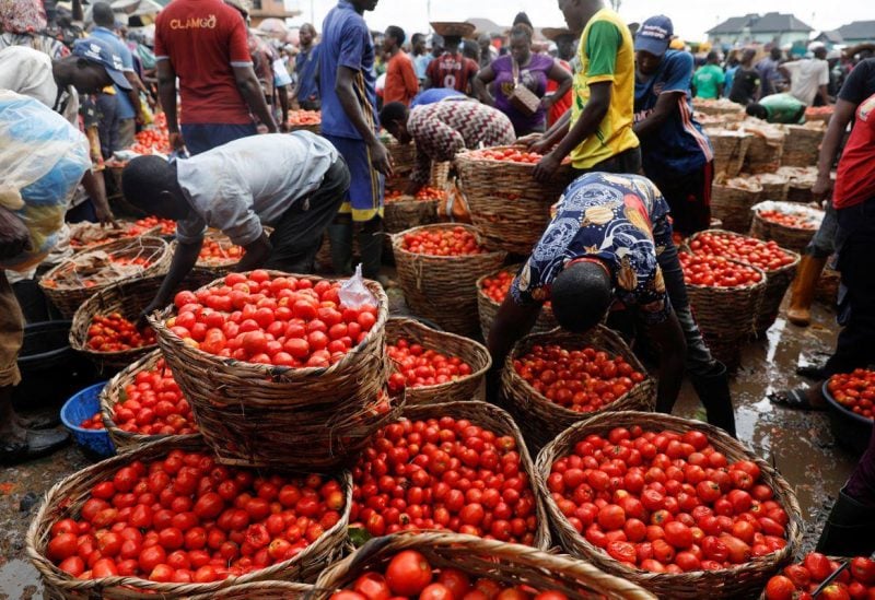 People buy and sell vegetables at Mile 12 International Market in Lagos, Nigeria May 13, 2022. REUTERS/Temilade Adelaja