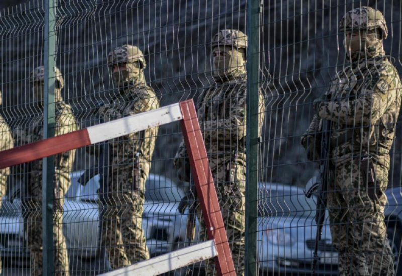 Azerbaijani servicemen stand guard at a checkpoint at the Lachin corridor on December 27, 2022. © Tofik Babayev, AFP
