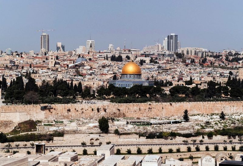 A view taken from the Mount of Olives shows a group of Jewish visitors on the Al-Aqsa compound, also known to Jews as Temple Mount, in Jerusalem's Old City, April 9, 2023. REUTERS/Dedi Hayun REFILE - QUALITY REPEAT