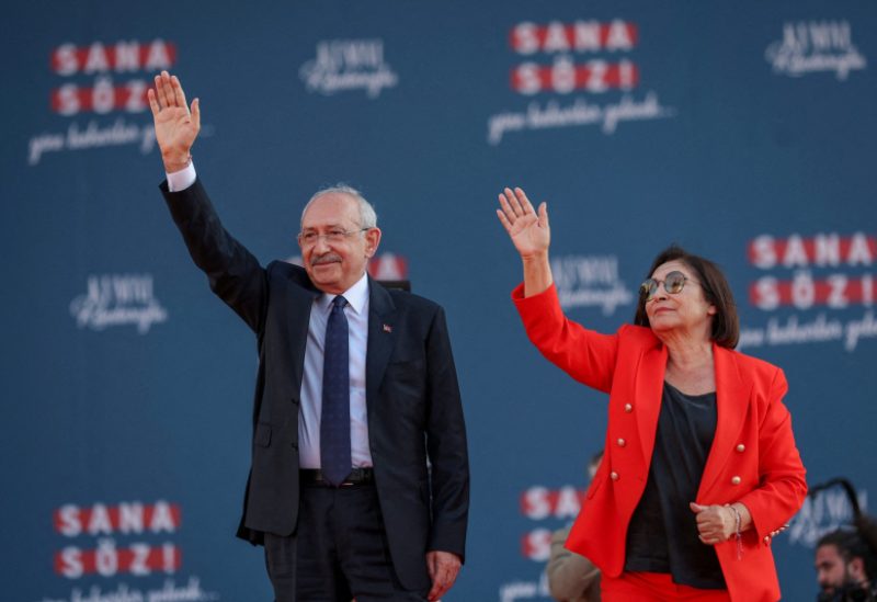 Kemal Kilicdaroglu, presidential candidate of Turkey's main opposition alliance, is flanked by his wife Selvi Kilicdaroglu as he greets his supporters during a rally ahead of the May 14 presidential and parliamentary elections, in Izmir, Turkey April 30, 2023. Alp Eren Kaya/Republican People's Party/Handout via REUTERS