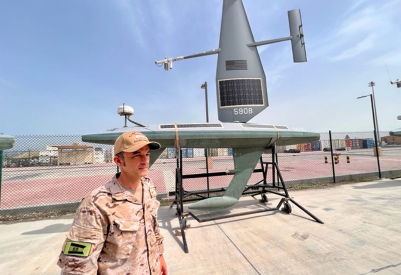 Spanish Navy Commander Jorge Lens with Saildrone Explorer solar and hydo USVs at the US naval base in Bahrain, on April 13.Photographer: Sam Dagher/Bloomberg
