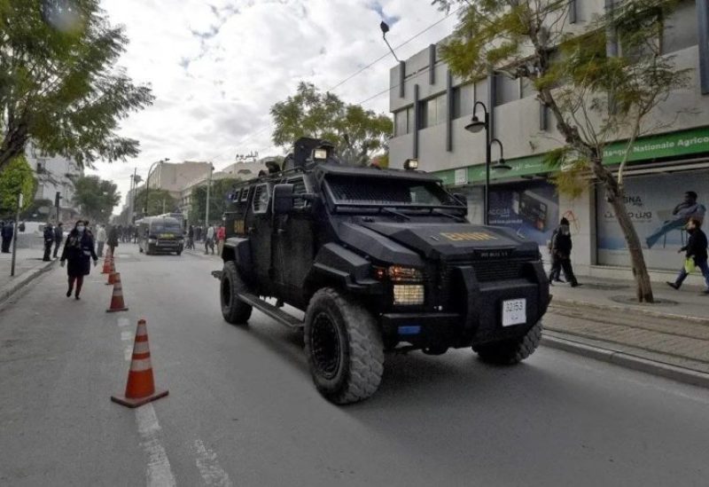 Tunisian security forces patrol along Habib Bourguiba avenue in the capital Tunis, on January 14, 2022. (AFP)