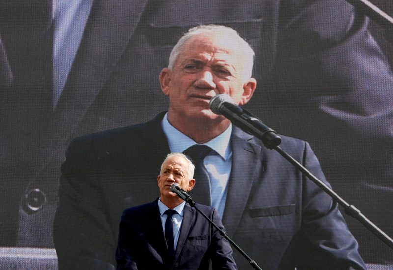 Israel's opposition leader Benny Gantz addresses protesters at a demonstration after Israeli Prime Minister Benjamin Netanyahu dismissed the defense minister as his nationalist coalition government presses on with its judicial overhaul, in Jerusalem, March 27, 2023. REUTERS/Ammar Awad/File Photo