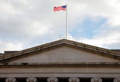 The American flag flies over the U.S. Treasury building in Washington, U.S., January 20, 2023. REUTERS/Jim Bourg/File Photo