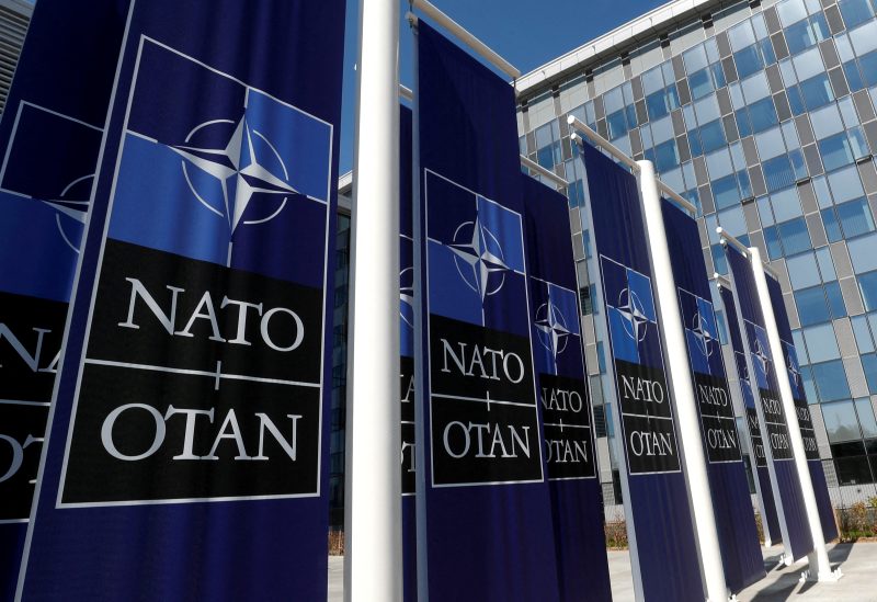 Banners displaying the NATO logo are placed at the entrance of new NATO headquarters during the move to the new building, in Brussels, Belgium April 19, 2018. REUTERS/Yves Herman