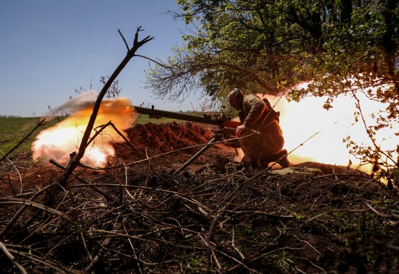 A Ukrainian service member from a 28th separate mechanised brigade named after the Knights of the Winter Campaign of the Armed Forces of Ukraine, fires an anti-tank grenade launcher at a front line, amid Russia's attack on Ukraine, near the city of Bakhmut, Ukraine May 3, 2023. REUTERS/Sofiia Gatilova