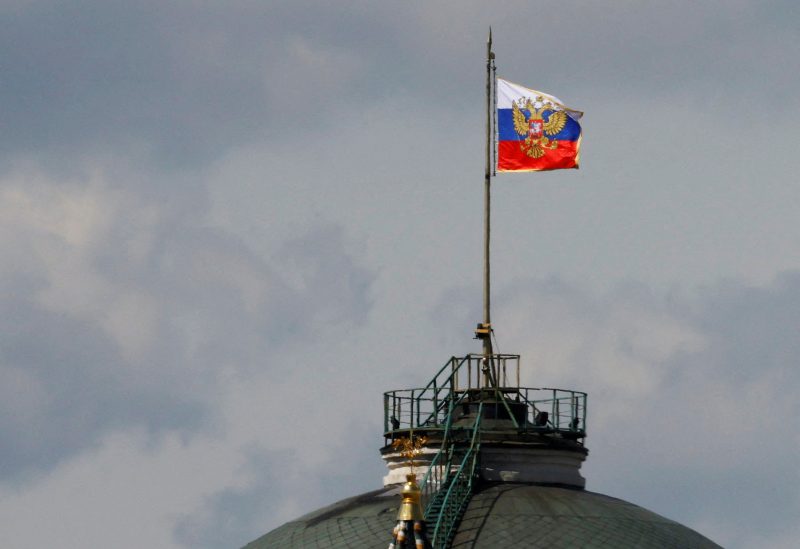 The Russian flag flies on the dome of the Kremlin Senate building, while the roof shows what appears to be marks from the recent drone incident, in central Moscow, Russia, May 4, 2023. REUTERS/Stringer
