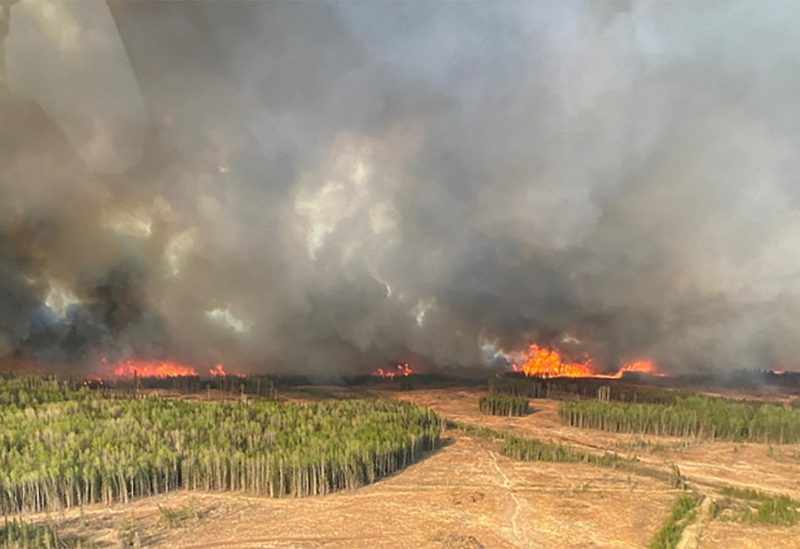 A smoke column rises from wildfire WWF023 near Fox Creek, Alberta, Canada May 5, 2023. Alberta Wildfire/Handout via REUTERS