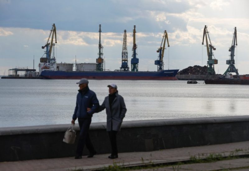 FILE PHOTO-People walk along an embankment near a local port, during the course of Russia-Ukraine conflict, in the Azov Sea city of Berdyansk, Zaporizhzhia region, Russian-controlled Ukraine, May 10, 2023. REUTERS/Alexander Ermochenko