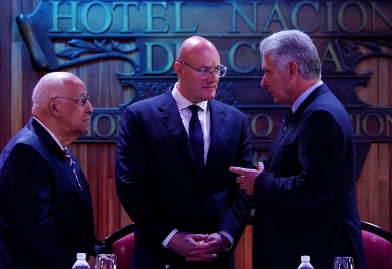 Cuba's President Miguel Diaz-Canel, Cuba's Foreign Trade and Investment Minister Ricardo Cabrisas and Deputy Prime Minister of the Russian Federation Dmitry Chernyshenko chat during a forum of Russian entrepreneurs in Havana, Cuba, May 19, 2023. REUTERS/Alexandre Meneghini