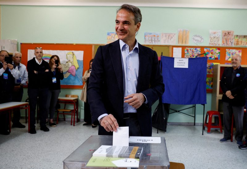 Greek Prime Minister and New Democracy conservative party leader Kyriakos Mitsotakis casts his ballot at a polling station, during the general election, in Athens, Greece, May 21, 2023. REUTERS/Louiza Vradi