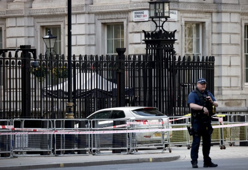 A police officer works at the site where a car crashed into the front gates of Downing Street in London, Britain, May 25, 2023. REUTERS/Henry Nicholls