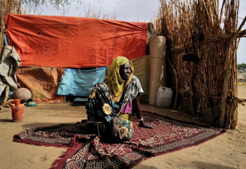 Halime Adam Moussa, a Sudanese refugee who is seeking refuge in Chad for a second time, sits beside her shelter, near the border between Sudan and Chad in Koufroun, Chad, May 10, 2023. REUTERS/Zohra Bensemra/File Photo