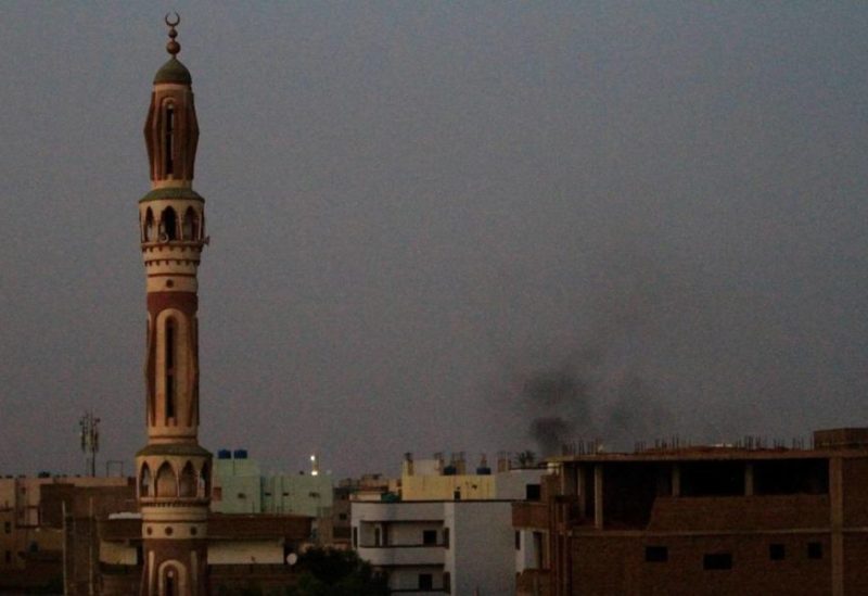 Smoke billows behind buildings in southern Khartoum, on May 27, 2023, amid ongoing fighting between the forces of two rival generals. (AFP)