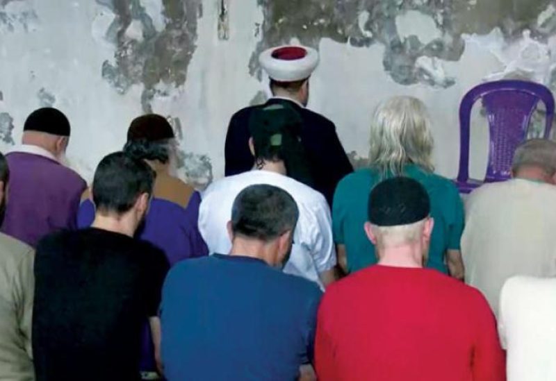 A photo released by the Lebanese Internal Security Forces shows prisoners performing Eid al-Fitr prayers in Roumieh jail. (ISF on Twitter)
