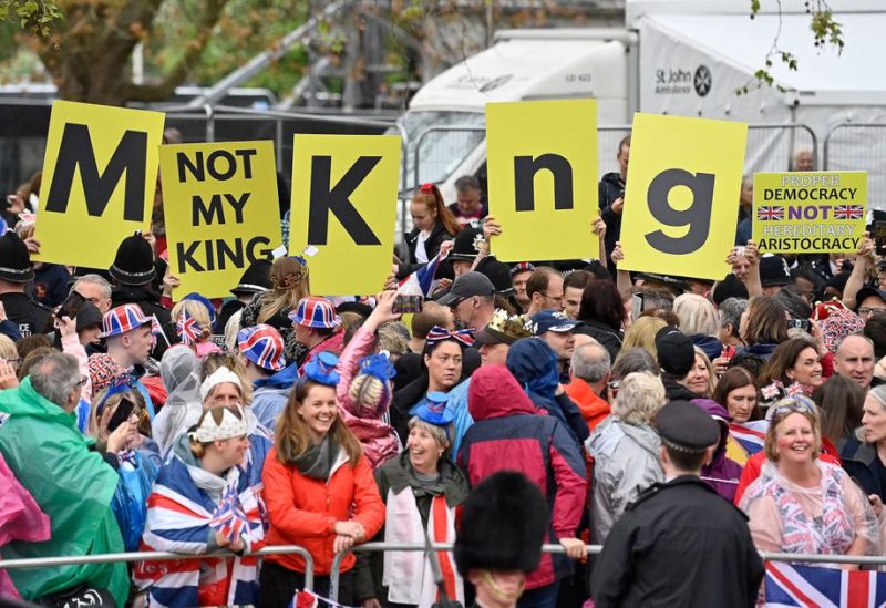 Protesters wave "Not My King" signs near to the 'King's Procession', a journey of two kilometres from Buckingham Palace to Westminster Abbey in central London on May 6, 2023