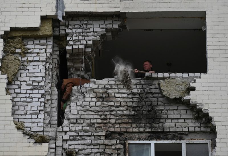 A local resident cleans from debris his apartment which was damaged by remains of a Russian missile, amid Russia's attack on Ukraine, in the town of Ukrainka, Kyiv region, Ukraine April 28, 2023. REUTERS/Viacheslav Ratynskyi