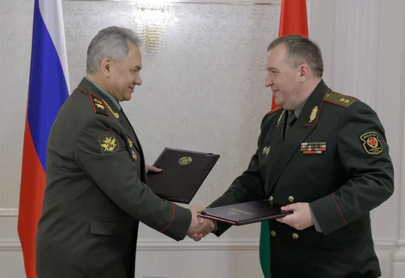 Russian Defence Minister Sergei Shoigu shakes hands with Belarusian Defence Minister Victor Khrenin during a meeting in Minsk, Belarus May 25, 2023