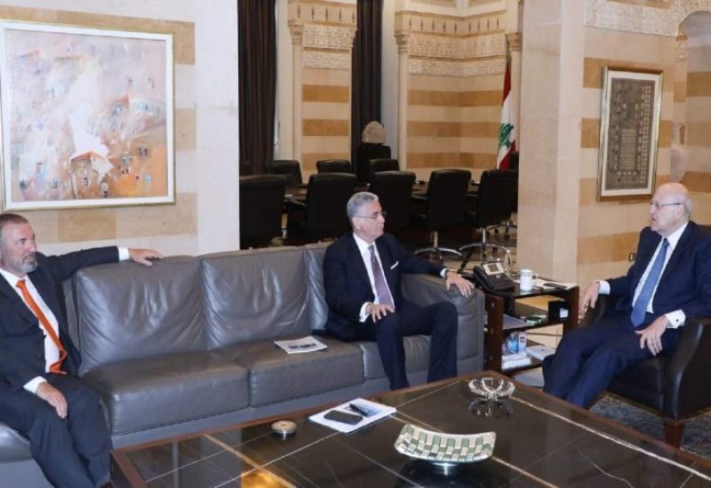Caretaker Prime Minister Najib Mikati with the World Bank Vice President for the Middle East and North Africa Ferid Belhaj