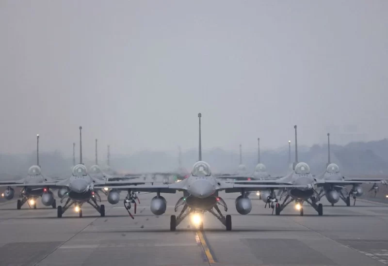 12 F-16V fighter jets perform an elephant walk during an annual New Year's drill in Chiayi, Taiwan, January 5, 2022. REUTERS