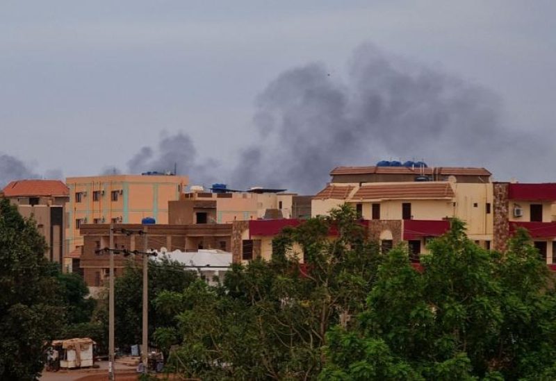Smoke billows over residential buildings in Khartoum on April 30, 2023 as deadly clashes between rival generals' forces have entered their third week. (AFP)